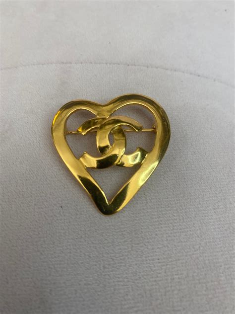 chanel c heart brooch|Chanel jacket brooch.